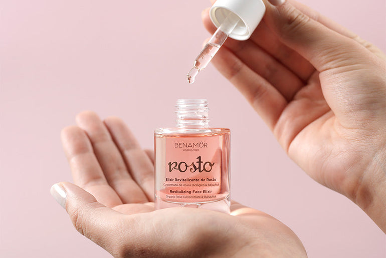 hands holding face elixir