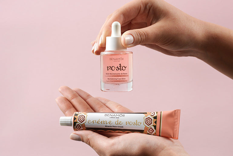 hands holding face elixir and face cream
