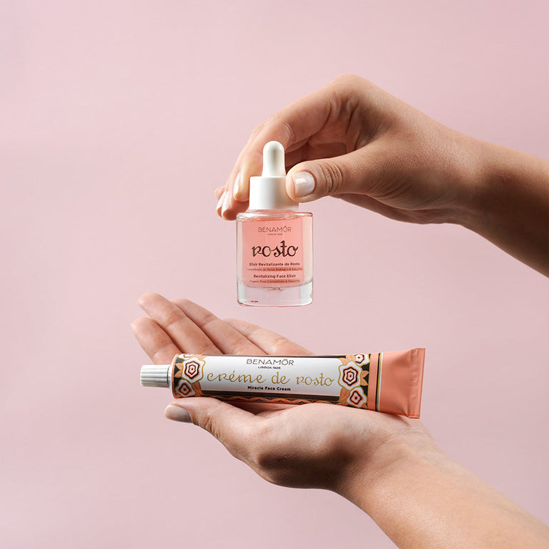hands holding face elixir and face cream