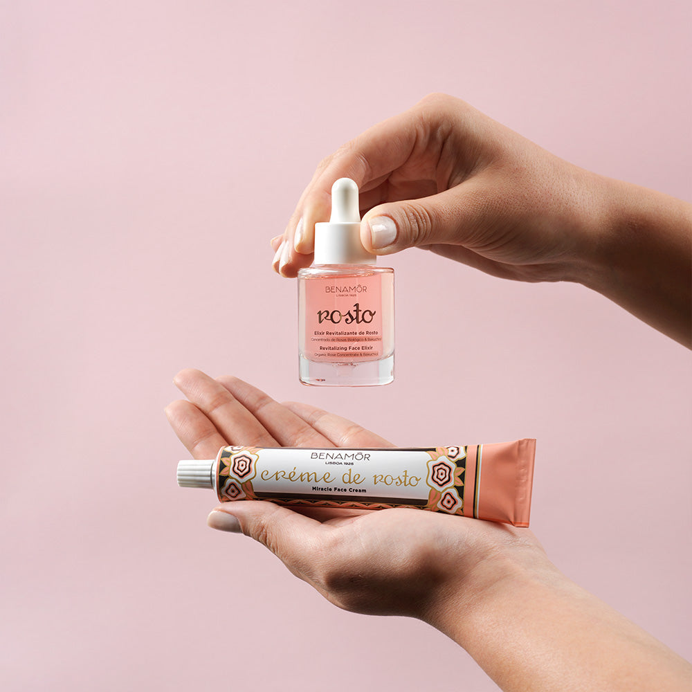hands holding face elixir and face cream