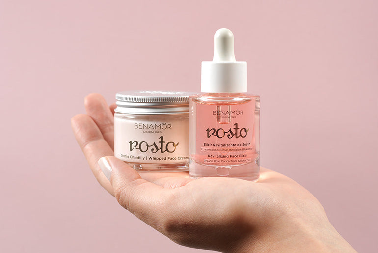 hands holding face elixir and face cream